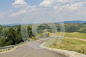 Hilla landscape and a road in the valley