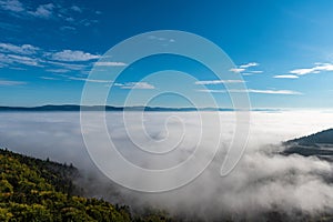 Hills above mist - view from Slavenska vyhlidka in CHKO Broumovsko in Czech republic