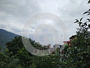 Hills, cloudy weather and beautifull small village`s houses