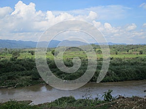 The hills and the dazzling cipunagara river flow