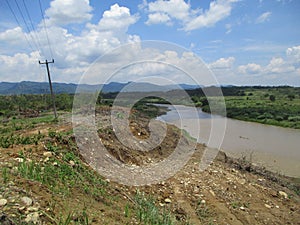 The hills and the dazzling cipunagara river flow