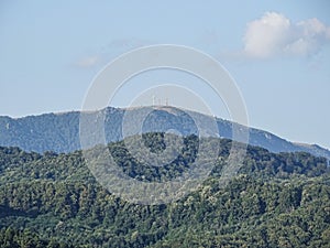 Hills and Ignis peak in the distance, near Baia Mare city, Romania photo