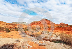 The hills are mountains of ancient sediments with patterns of erosion