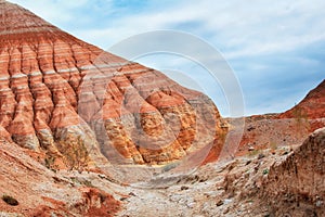 The hills and mountains of ancient sediments with patterns of erosion, red yellow and white clay