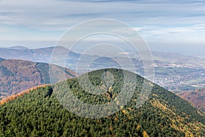 Hills and mountains on the horizon of beautiful nature with city in the forest valley view into vast distance of the Beskids Area