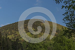 Hills over Trojanovice village in spring sunny color evening photo