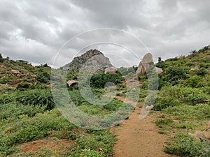 Hills with a pains shaped stone near Lord shiva statue surrouneded by hills at Panukonda fort in Anantapur Andhra Pradesh India