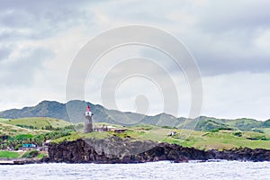 Hills of Sabtang Island with Lighthouse fronting the shore at, Batanes, Philippines