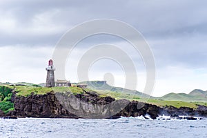 Hills of Sabtang Island with Lighthouse fronting the shore at, Batanes, Philippines