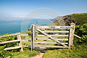 Hills in southwest wales looking through a gate at the sea