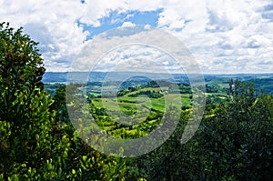 Hills, vineyards and cypress trees, Tuscany landscape near San Gimignano