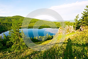 The hillside and blue lake