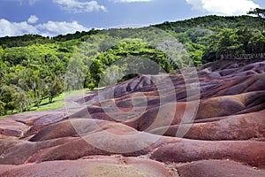 A hillside with brightly color sand in the Chamarel, Mauritius,