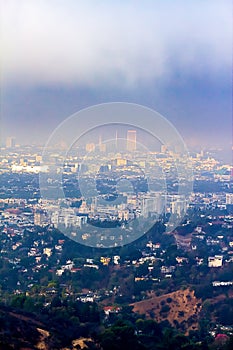 Hillside view of Burbank and Wilshire buildings in haze