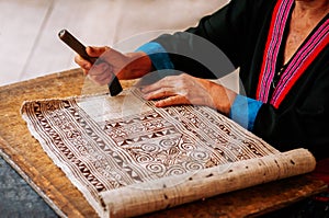 Hilltribe woman hand do Batik fabric painting