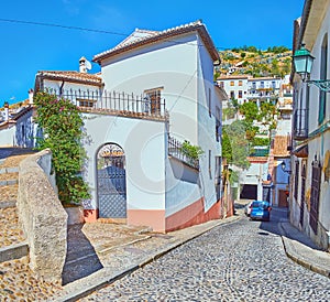 The hilly Cuesta del Chapiz street, Albaicin, Granada, Spain photo