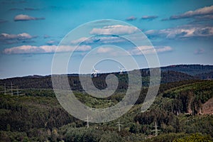 hilly forested Siegerland with electricity pylons