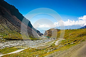 Hilly highway with green pasture and blue sky on the way to himalaya from the road,manali tourism Himachal leh ladakh, India