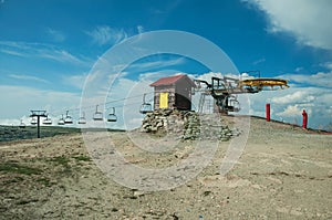 Hilly landscape with chairlift mechanism and towers