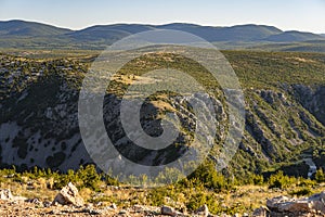Hilly landscape in Croatia with terrain covered in Maquis shrubland