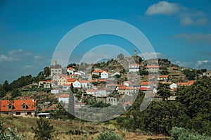 Hilly landscape with houses of a small village on top