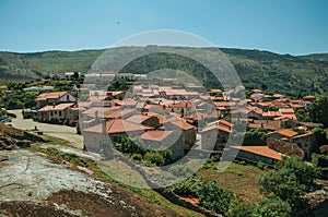 Hilly landscape with the roofs from village