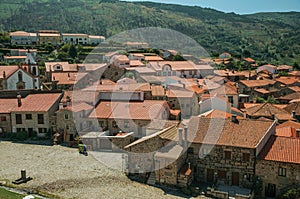 Hilly landscape with the roofs from village