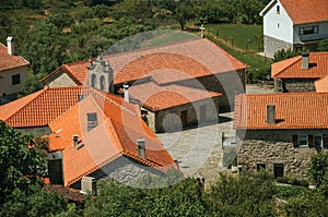 Hilly landscape with the roofs from village