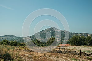 Hilly landscape with the small Monsanto village on top