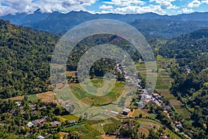 Hilly landscape of Sri Lanka dotted with villages and tea planta