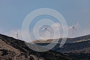 Hilly landscape with wind turbines at the westcoast of Rhodes island, Greece