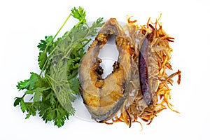 Hilsa fish fry, onion and dried chilly with Coriander leaf in plate.