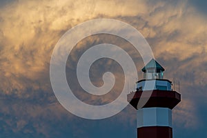 Hilton head lighthouse captured against clouds blocking a sunset
