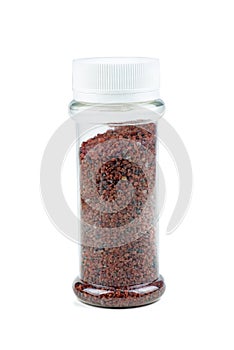 Himalayan black salt in plastic bottle isolated on white