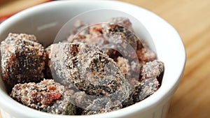 Himalayan black salt rock crystals, Kala Namak in a container on table