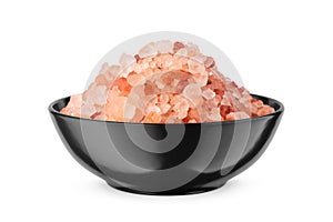 Himalayan coarse salt in black bowl isolated on white. Front view