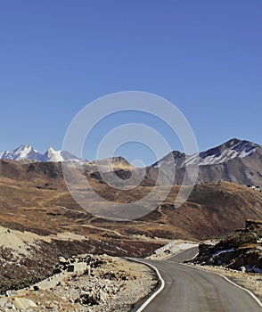 Himalayan mountain road and snow clad peak