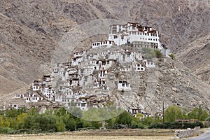 Himalayan mountains and Chemrey gompa, Buddhist monastery in Ladakh, India