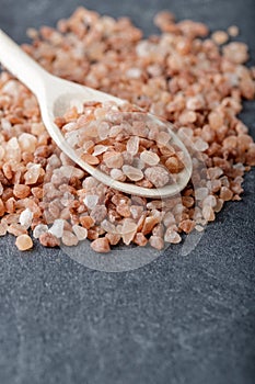 Himalayan pink coarse salt on a wooden spoon