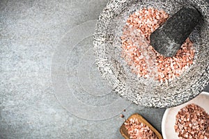 Himalayan pink salt seed in granite mortar or pestle