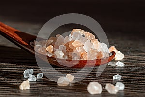 Himalayan pink salt in a wooden is used to flavor food