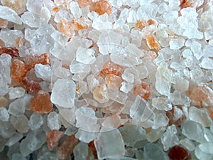 Himalayan salt background and close-up, selective focus. Coarse pink crystals.