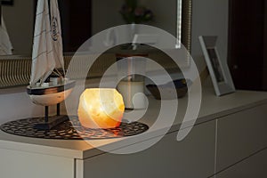 Himalayan salt lamp glowing in dark