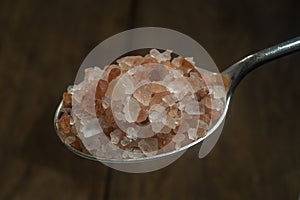 Himalayan salt silver spoon. Close-up.
