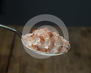 Himalayan salt silver spoon. Close-up.