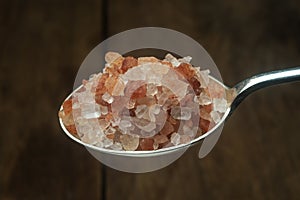 Himalayan salt silver spoon. Close-up.
