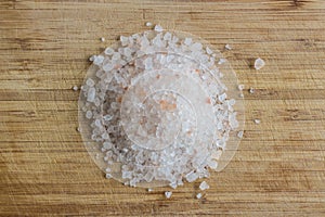 Himalayan salt on a wooden cutting board