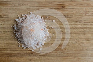 Himalayan salt on a wooden cutting board