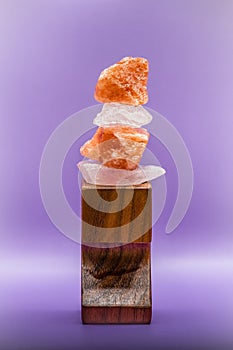 Himalayan Sea Salt stacked on a wooden stand