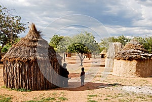 Himba village with traditional huts near Etosha National Park in Namibia